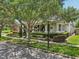 Charming home featuring a wide porch, mature landscaping, and a welcoming curb appeal at 3201 Glenmere Way, Orlando, FL 32828