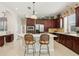 Well-equipped kitchen with stainless steel appliances, ample counter space, and stylish cabinetry at 3201 Glenmere Way, Orlando, FL 32828