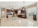 Spacious kitchen with stainless steel appliances, island with seating, and ample cabinet space at 3201 Glenmere Way, Orlando, FL 32828