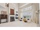 Bright, open living room with tall ceilings, fireplace and large windows with shutters at 3201 Glenmere Way, Orlando, FL 32828