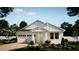Charming single-Gathering home with a two-car garage, pristine landscaping, and a welcoming front porch at 347 Ridgemark Ave, Groveland, FL 34736