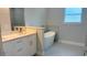 Modern bathroom features a soaking tub, double vanity, and tiled floors at 3498 Sw 131St Place Rd, Ocala, FL 34473