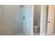 Bright bathroom featuring a walk-in shower with modern fixtures and a separate toilet room at 3498 Sw 131St Place Rd, Ocala, FL 34473