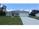 Charming single-story home with a well-manicured lawn and a two-car garage in a suburban neighborhood at 3498 Sw 131St Place Rd, Ocala, FL 34473