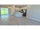 Open-concept kitchen features modern white cabinetry and stainless steel appliances at 3498 Sw 131St Place Rd, Ocala, FL 34473