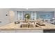 Open-concept kitchen featuring a center island with sink, granite countertops, and stainless steel appliances at 3507 Costello Cir, Winter Haven, FL 33884