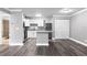 Bright kitchen featuring white cabinets, sleek countertops, stainless steel appliances, and kitchen island at 380 Lake Ontario Ct # 201, Altamonte Springs, FL 32701