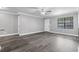 Bright living room featuring neutral paint, ceiling fan, sleek flooring, and natural light at 380 Lake Ontario Ct # 201, Altamonte Springs, FL 32701