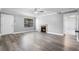 Cozy living room featuring neutral paint, ceiling fan, sleek flooring, natural light, and fireplace at 380 Lake Ontario Ct # 201, Altamonte Springs, FL 32701