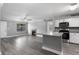 Open-concept living room with a fireplace and adjacent kitchen featuring granite countertops at 380 Lake Ontario Ct # 201, Altamonte Springs, FL 32701