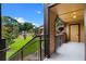 Spacious porch has neutral paint, railings, view of building and stairway, and blue skies at 380 Lake Ontario Ct # 201, Altamonte Springs, FL 32701