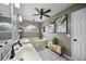 Elegant bathroom featuring double sinks, a soaking tub, and stylish decor at 383 Remington Dr, Oviedo, FL 32765
