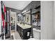 Bathroom with modern decor, dark grey walls, floating shelves, and a contrasting vanity at 383 Remington Dr, Oviedo, FL 32765