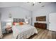 Comfortable bedroom featuring an art piece, a ceiling fan, and wood laminate flooring at 383 Remington Dr, Oviedo, FL 32765