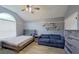 This bedroom boasts a ceiling fan, natural light, and comfortable seating area at 383 Remington Dr, Oviedo, FL 32765