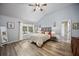 Bright bedroom featuring stylish decor, a ceiling fan, and a view to the outside at 383 Remington Dr, Oviedo, FL 32765