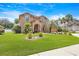 Charming two-story brick home with beautiful yard and lush landscaping at 383 Remington Dr, Oviedo, FL 32765
