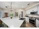 Kitchen features a white quartz island, stainless steel appliances, and modern finishes at 383 Remington Dr, Oviedo, FL 32765