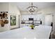 A bright kitchen features white cabinets, stainless appliances, and an oversized quartz island at 383 Remington Dr, Oviedo, FL 32765