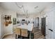 Bright kitchen featuring a large island, modern appliances, and ample cabinet space at 383 Remington Dr, Oviedo, FL 32765