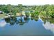 Scenic lake view featuring a gazebo on the water surrounded by lush greenery and lily pads at 383 Remington Dr, Oviedo, FL 32765