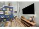 Cozy living room with high ceilings, a large TV, and stylish decor at 383 Remington Dr, Oviedo, FL 32765