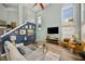 Stylish living room with vaulted ceiling, tall windows, and contemporary furnishings at 383 Remington Dr, Oviedo, FL 32765
