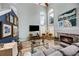 Spacious living room features high ceilings, abundant natural light, and stylish decor at 383 Remington Dr, Oviedo, FL 32765