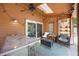 Cozy covered patio with ceiling fan, skylight, bar, and sliding glass door access to the home at 383 Remington Dr, Oviedo, FL 32765