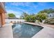 Backyard pool with lounge chairs, well-maintained landscaping and privacy fence, perfect for relaxation at 383 Remington Dr, Oviedo, FL 32765