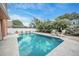 Backyard with a beautiful pool and landscaped yard providing a serene outdoor retreat at 383 Remington Dr, Oviedo, FL 32765