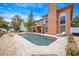 Backyard with a pool, patio area, and a glimpse of the exterior of the house at 383 Remington Dr, Oviedo, FL 32765