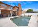 A backyard pool with concrete patio, outdoor grill, and beautiful landscaping on a sunny day at 383 Remington Dr, Oviedo, FL 32765