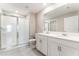 Modern bathroom featuring a double sink vanity and glass shower at 3971 Guernsey Bnd, St Cloud, FL 34772
