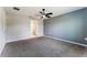 The bedroom has neutral paint, gray carpet, and access to an ensuite bathroom at 3971 Guernsey Bnd, St Cloud, FL 34772