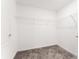 Walk-in closet with carpeted flooring and wire shelving at 3971 Guernsey Bnd, St Cloud, FL 34772