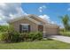 Charming single-story home with neutral exterior, two-car garage, and well-maintained lawn at 3971 Guernsey Bnd, St Cloud, FL 34772