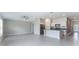Open floorplan featuring a spacious kitchen with white cabinets and stainless steel appliances at 3971 Guernsey Bnd, St Cloud, FL 34772