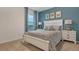 Bedroom with a queen bed, stylish lamps, and a cozy atmosphere at 4908 Kaia Ave, Winter Haven, FL 33884