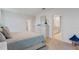Bright main bedroom featuring a dresser, views to adjacent bathroom and walk-in closet at 4908 Kaia Ave, Winter Haven, FL 33884