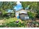 A spacious backyard with lush greenery and mature trees at 513 Dew Drop Cv, Casselberry, FL 32707