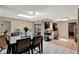 Eat-in kitchen features tile floor, dark cabinetry and sliding doors to the patio at 513 Dew Drop Cv, Casselberry, FL 32707
