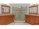 Well-appointed bathroom featuring dual sinks and a glass-enclosed shower at 6057 Lake Pointe Dr # 408, Orlando, FL 32822