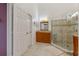 A bathroom showcasing a modern vanity and a glass-enclosed shower at 6057 Lake Pointe Dr # 408, Orlando, FL 32822