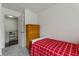 Comfortable bedroom featuring a twin bed, and view of upstairs railing at 6057 Lake Pointe Dr # 408, Orlando, FL 32822