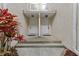 Charming condo entrance with dual entry doors, complimented by a lush tropical plant, offering curb appeal at 6057 Lake Pointe Dr # 408, Orlando, FL 32822