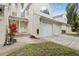 Inviting condo featuring a one-car garage and well-maintained landscaping, creating a welcoming curb appeal at 6057 Lake Pointe Dr # 408, Orlando, FL 32822