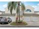 Charming townhome exterior with well-maintained landscaping, a two car garage, and inviting curb appeal at 6057 Lake Pointe Dr # 408, Orlando, FL 32822