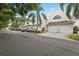 Charming townhome exterior, featuring well-maintained landscaping, a two car garage, and a welcoming curb appeal at 6057 Lake Pointe Dr # 408, Orlando, FL 32822