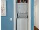 Convenient stacked washer and dryer unit in a utility closet at 6057 Lake Pointe Dr # 408, Orlando, FL 32822